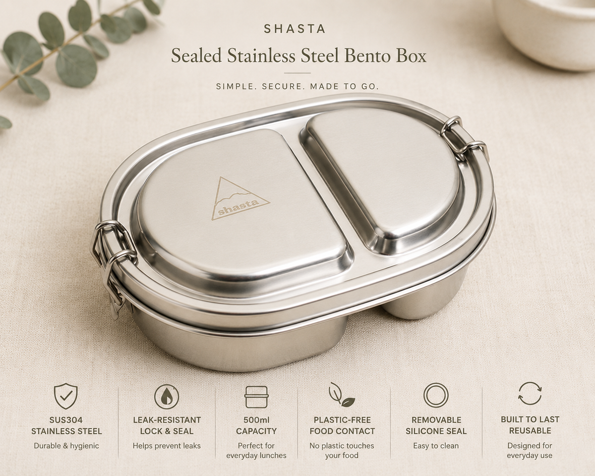 Close-up of stainless steel sealed Bento Box with dual compartments, secure latch, and Shasta logo, designed for durable food storage