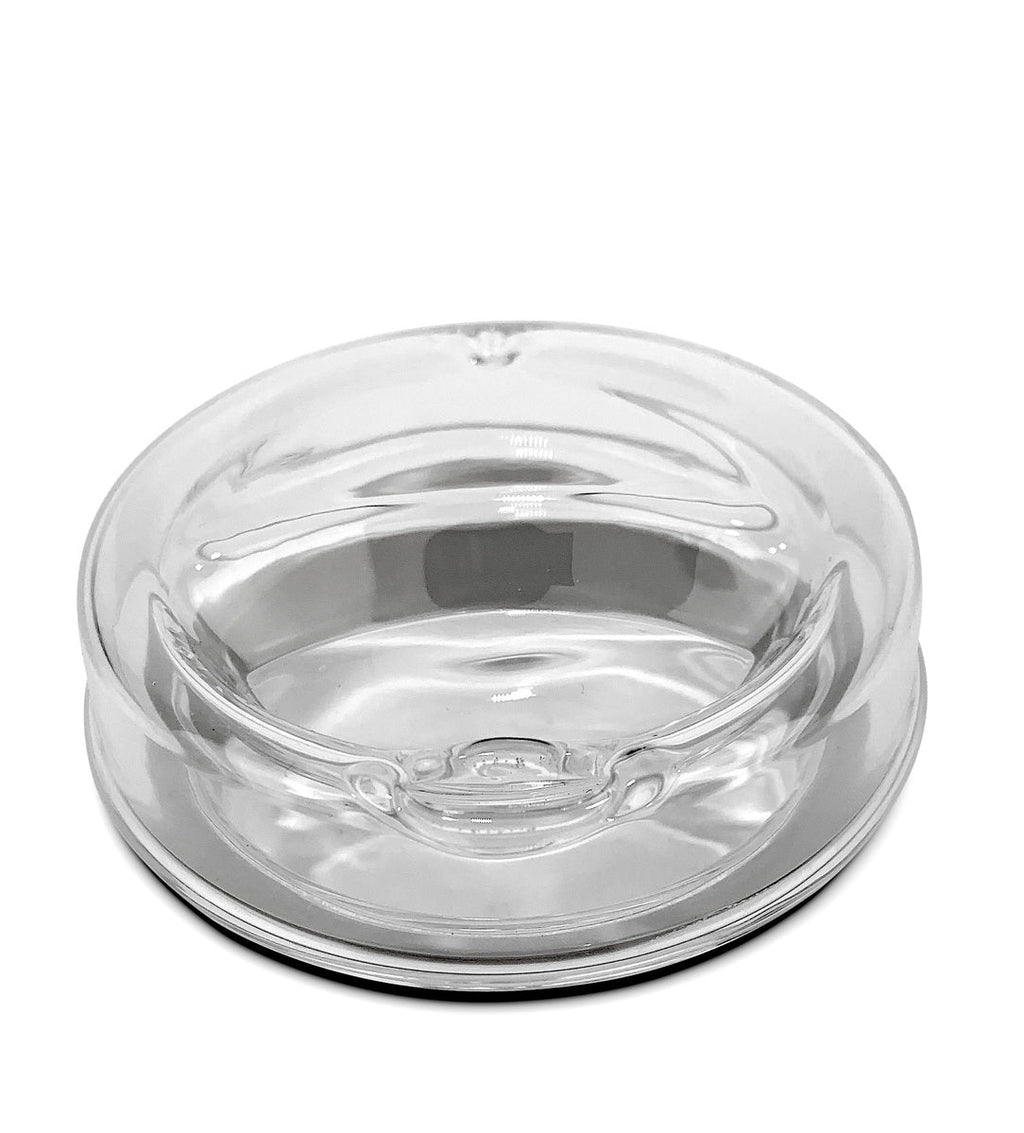 Close-up of clear borosilicate glass travel cup with lid, showing the double wall insulation and black silicone sleeve for grip and temperature control.