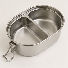 Empty stainless steel divided food container with lid, designed for meal storage, on neutral background