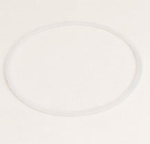 Round silicone sealing ring for stainless steel bento box, ensuring airtight closure, on beige fabric